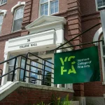 Red brick building with Vermont College of Fine Arts flag in front.